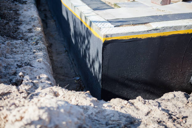 Professional Basement Waterproofing technician working in Moundville, AL